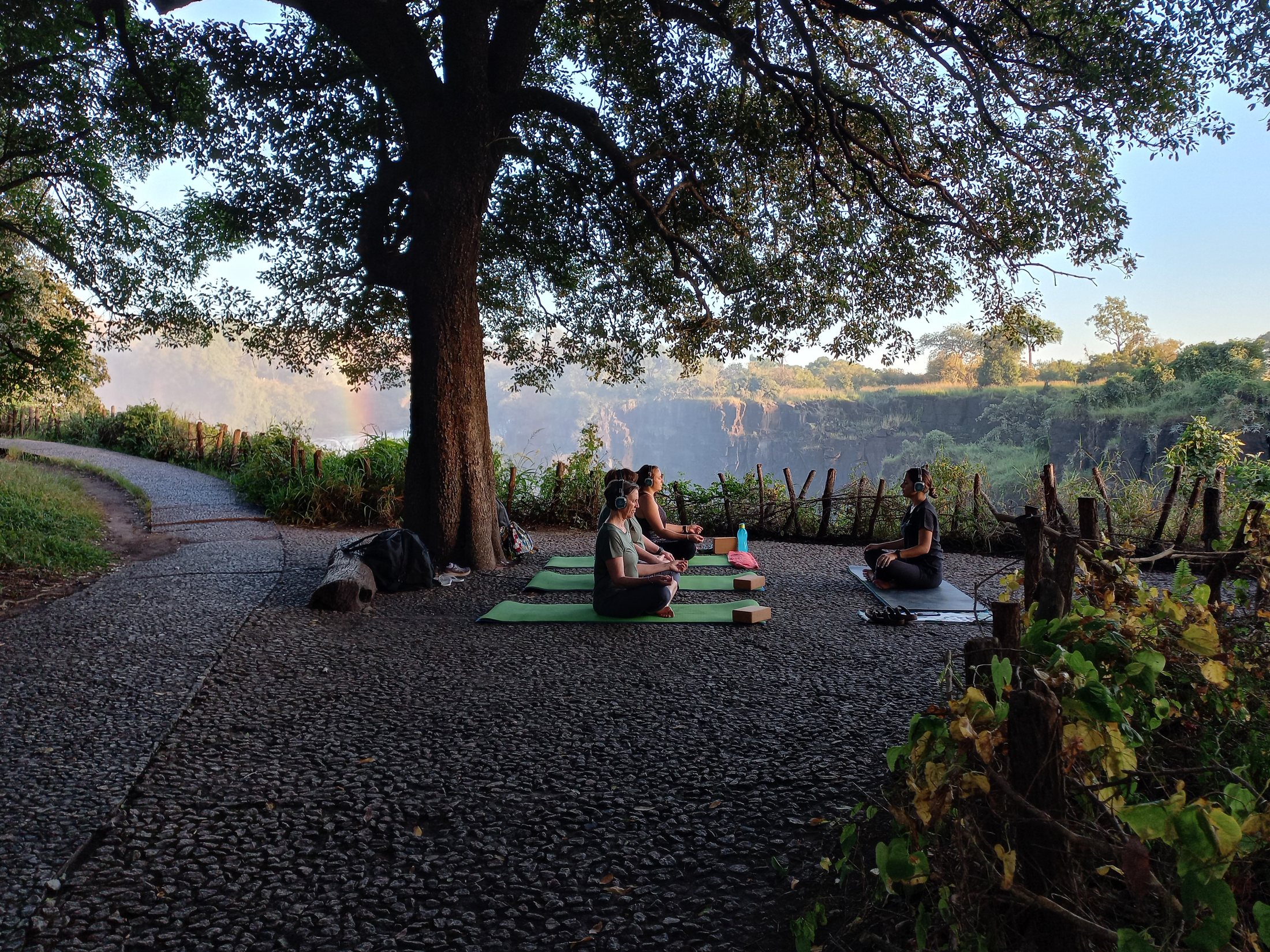 Solo yoga practice overlooking Victoria Falls